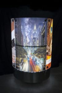 Glass column with city background